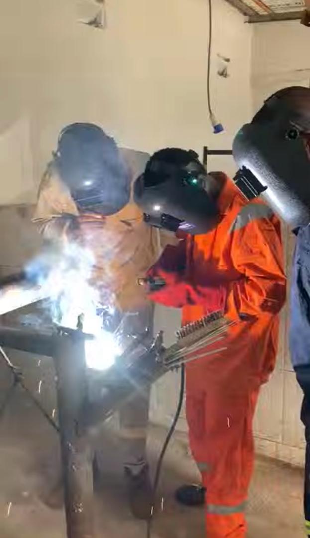 Earthoc trainees working with industrial equipment