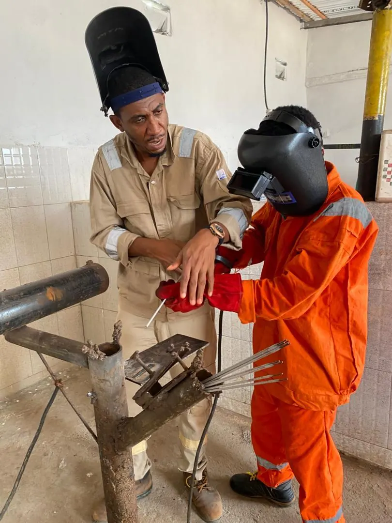 Earthoc trainees working with industrial equipment